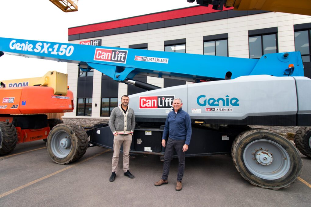 CanLift's Managing Partner, Johnny Dragicevic stands with Director of Business Develpoment, Joe Gould, in front of CanLift's biggest boom lifts.